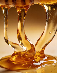 Detailed Shot of Flowing Honey Texture Captured Mid-Drip with Radiant Golden Highlights, Luxury Sensory Food-Inspired Abstract Background, Smooth Viscosity and Premium Indulgent Visual Appeal