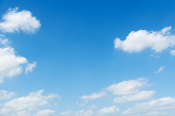 Fototapeta premium Background of blue sky with some white clouds