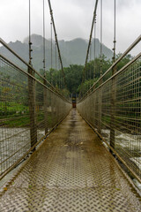 Obraz premium Bridge with a metal railing and a view of a river