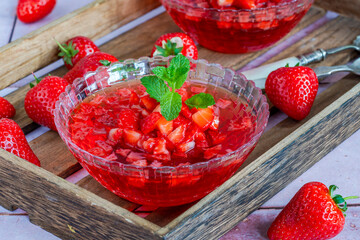 Homemade fruit jelly with fresh strawberries