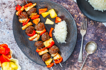 Beef meatballs kebab skewers glazed with sweet and sour sauce