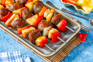 Beef meatballs kebab skewers glazed with sweet and sour sauce