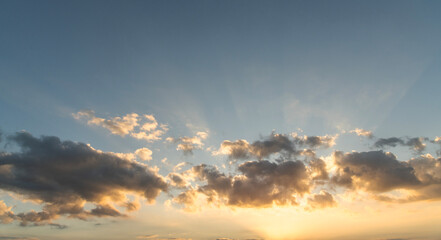 Beautiful bright orange sunset sky with clouds.