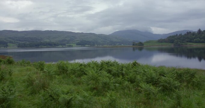 Extra wide panning shot of Loch Etive and Eilean Traighe