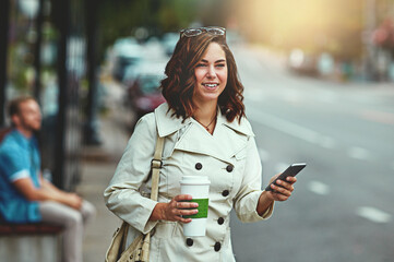 Fototapeta premium Coffee, phone and waiting with woman in city for communication, commute or internet search. Beverage, space and travel app with happy person outdoor on street for direction, journey or taxi booking