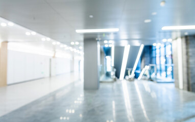 Blur background of escalator and marble floor in modern building