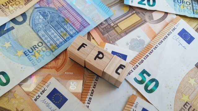 FPE acronym made of wooden letter cubes on pile of Euro banknotes. Fundo de Pensoes Empresarial (Corporate Pension Fund)