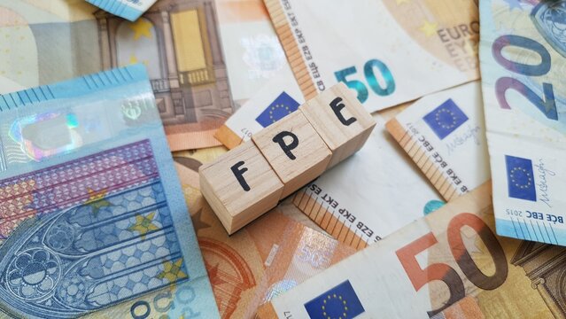 FPE acronym made of wooden letter cubes on pile of Euro banknotes. Fundo de Pensoes Empresarial (Corporate Pension Fund)