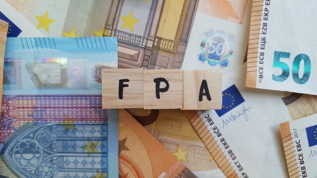 FPA acronym made of wooden letter cubes on pile of Euro banknotes. Fundo de Pensoes de Aposentadoria (Retirement Pension Fund)