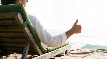 Man relaxing on a beach chair with a thumbs up gesture enjoying a serene ocean view on a sunny day feeling happy and relaxed.