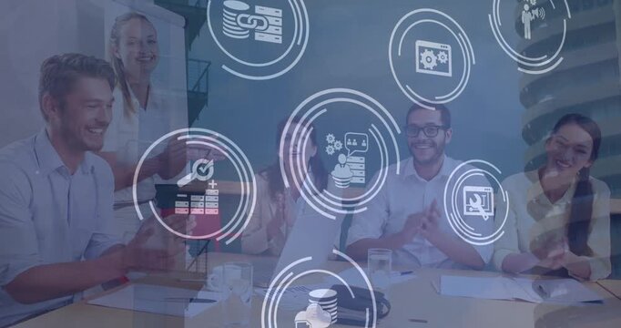 Video of technology icons over blue background with diverse businesspeople talking in office