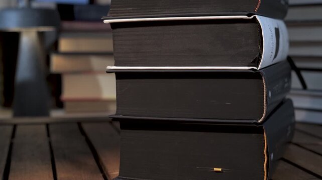 Stack of Thick Hardcover Books on Wooden Table, Close up view emphasizing knowledge, education, research, and academic depth