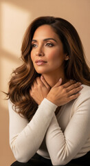 Beautiful young woman with long hair gazing thoughtfully, soft lighting accentuates her face, portrait conveying elegance and serenity.