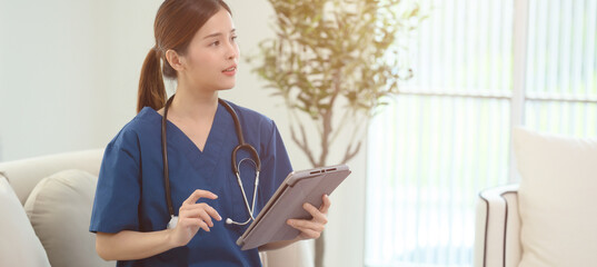Smart attractive female doctor sitting in examination room Smiling and looking at the camera Trust health care workers in the hospital concept	