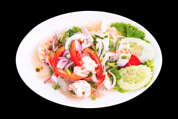 spicy seafood salad on white plate isolated on black background including clipping path, top view