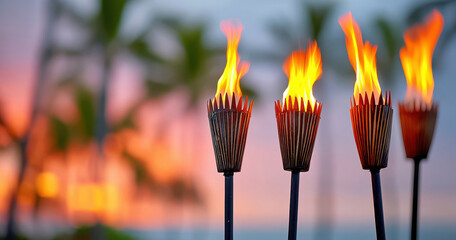 Tiki torches with a tropical sunset and palm trees in the background