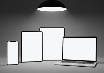 Digital Devices with Blank Screens Under Lamp