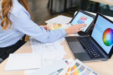 Designer creating home plans using digital tools