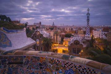 Obraz premium Sunrise glow over Park Guell, a masterpiece in Barcelona, Catalonia