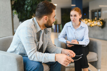 Man visiting psychologist discussing mental health solution