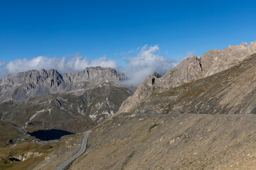 Fototapeta premium High-altitude mountain panorama from Col du Galibier in the French Alps, with sweeping views of peaks and valleys.