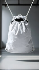 White Drawstring Bag on Table with Shadows.