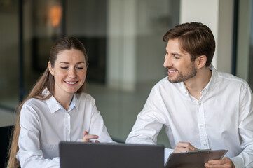 Obraz premium Colleagues having a video conference with the client and looking involved