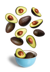 Avocados falling and levitating into blue bowl