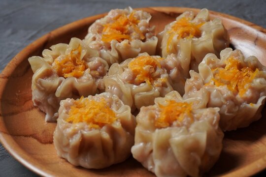 Closeup imgae of dimsum with carrot toping on top