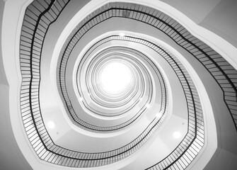 Obraz premium Towards the light, staircase black and white shot.