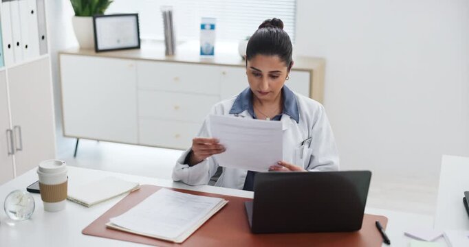 Doctor, woman and laptop with document for health insurance, medical aid or patient information. Healthcare worker, person and computer in office with paperwork for policy, planning or typing report.