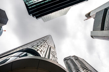 Frankfurt Germany skyscraper architecture corporate highrise facade perspective modern sky framing a downtown office skyline shot from a low angle