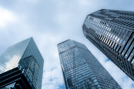 Frankfurt Germany skyscraper architecture corporate glass modern urban perspective with blue sky reflections on high office towers