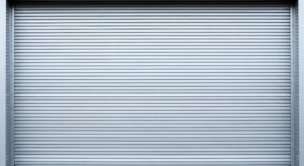 Fototapeta premium Closed gray metal security shutter door with horizontal slats and frame