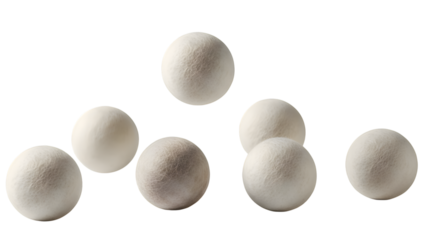 Collection of white powder filled spheres floating in air isolated on transparent background