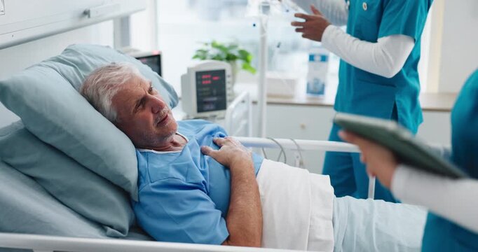 Nurse, old man or conversation in hospital bed with tablet, medical assessment or chest pain complaint. Healthcare worker, elderly person and talk in clinic with tech, respiratory issue and check up.