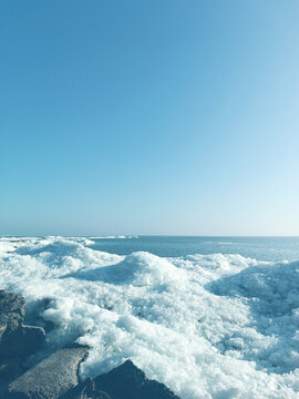 Frozen ice on a sea background