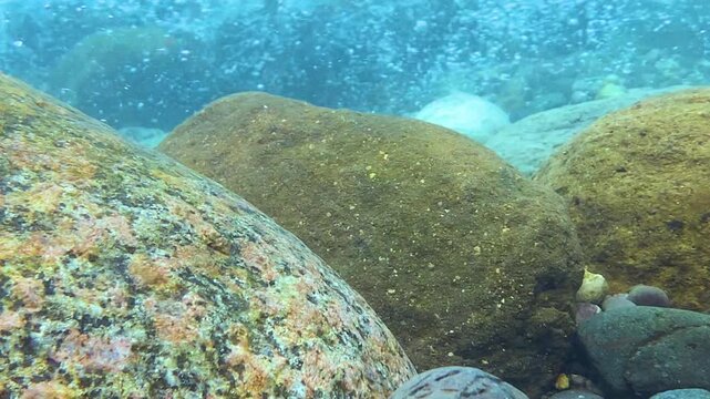 Underwater view of boulders in fast flowing River, Bichanakandi, Sylhet, Bangladesh