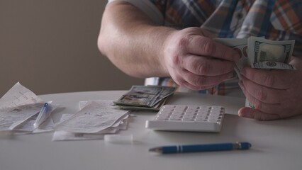 Counting cash and reviewing receipts at a table during a quiet afternoon