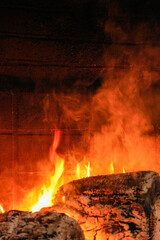 A fireplace with a lot of smoke coming out of it