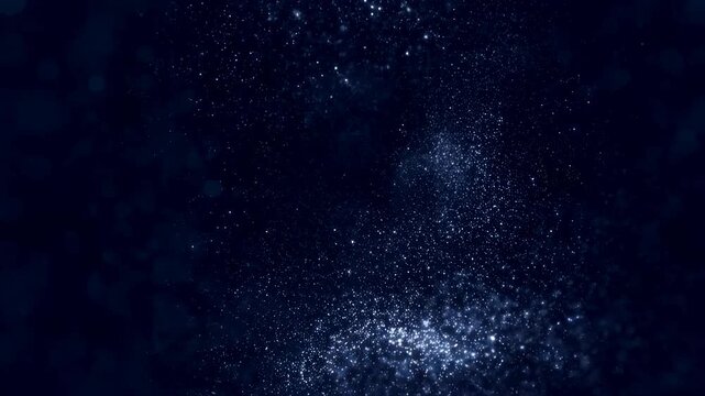 Abstract shimmering particles in dark space. Represents the beauty of the cosmos and the mystery of the universe