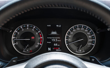 Analog dashboard car with light status symbol