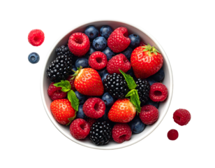 Overhead shot of a white bowl overflowing with a mix of vibrant berries on black