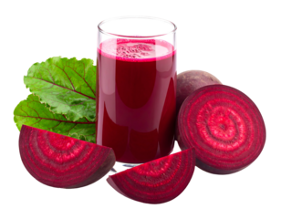 Vibrant beet juice in glass next to beets and leaves, isolated on black