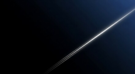 Diagonal bright light beam flare on dark background