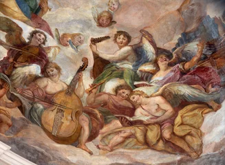 Fotobehang Jezus Christus SALZBURG, AUSTIRA - SEPTEMBER 7, 2025: The angels with the music instruments in the cupola of church Dreifaltigkeitskirche (Holy Trinity) by Johann Michael Rottmayr (1679 - 1700).  © Renáta Sedmáková