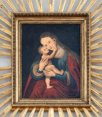 Fototapeta premium SALZBURG, AUSTIRA - SEPTEMBER 7, 2025: The painting of Madonna in the church Andrea kirche by unknown artist