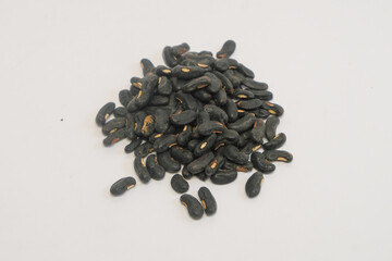 Close up of a pile of black long bean seeds isolated on a white background. Agricultural industry concept. Graphic design, banner and 3D rendering