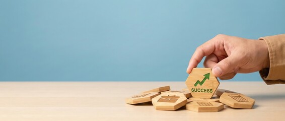 Hand placing Success hexagon with green arrow graph, business growth concept