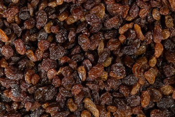 Obraz premium Macro top view of dried grapes, sweet organic raisins.